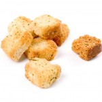 Small pile of herb croutons on a white background